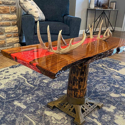 Wooden table with antler design in a living room setting