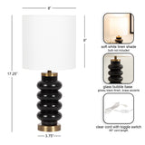 Table lamp with a white linen cylindrical shade and a glossy black glass bubble base accented by brass, shown with size dimensions and cord details