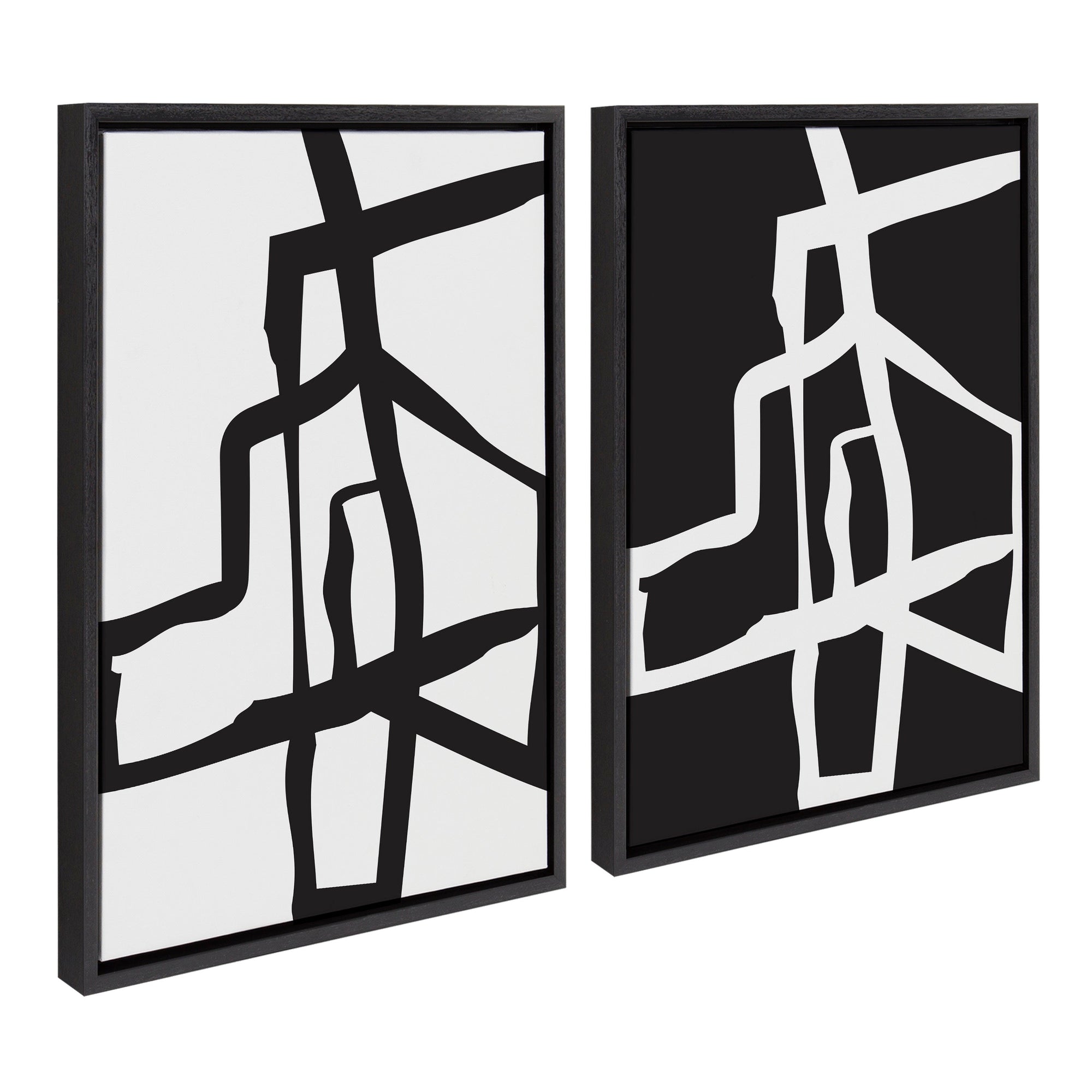 Two framed abstract black and white canvases with bold brushstroke designs displayed side by side on a wide wall