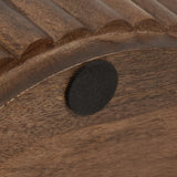 Close-up of rounded wooden slats with a dark round felt pad attached on a smooth wood surface, highlighting natural grain and texture.