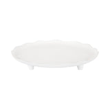 White ceramic decorative tray with an irregular scalloped edge and three short rounded legs, shown against a white background.