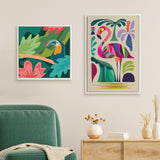 Two colorful framed canvases on a beige wall: left shows a tropical toucan amid green and coral foliage, right depicts a stylized pink and purple flamingo with abstract plants.