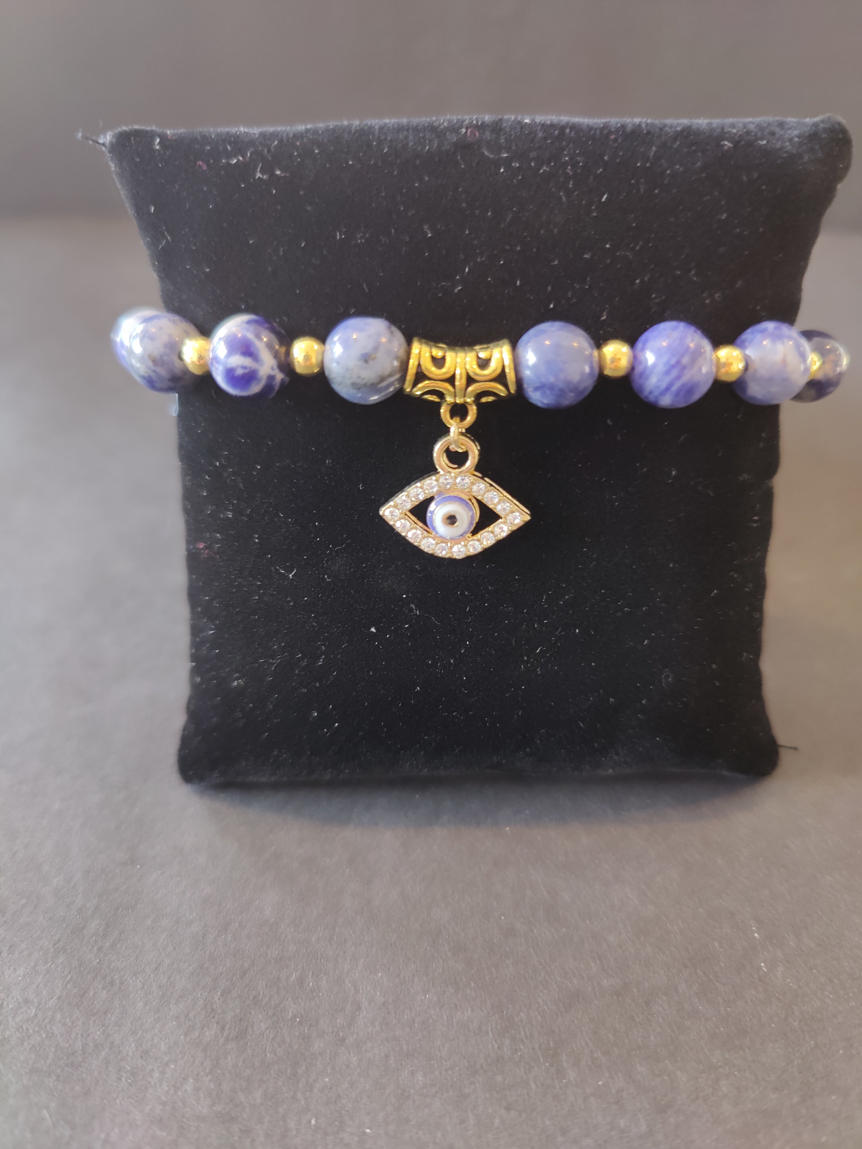 Evil Eye Charm Sodalite Beaded Bracelet by Rare Earth Gallery - main product image for Resin Society