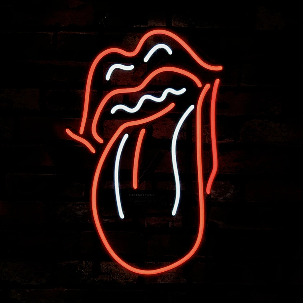 Rolling Stones Tongue Neon Sign Light glowing in orange and red hues against a dark wall