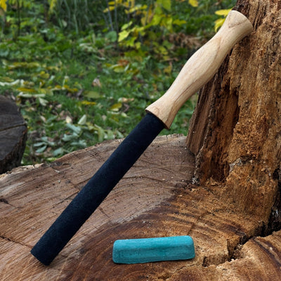 Round leather strop with ash wood handle for knife sharpening
