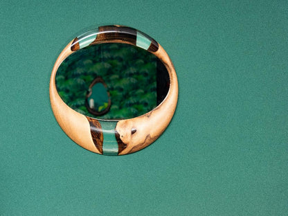 Handcrafted epoxy resin and walnut mirrors in round and teardrop shapes