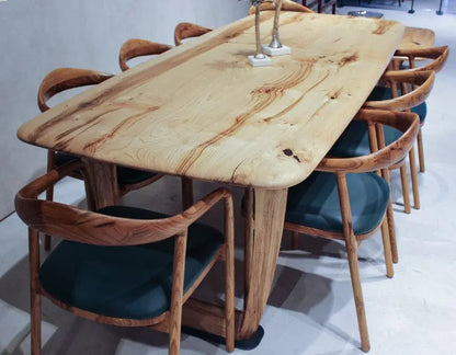 Rustic solid chestnut wood dining table with chestnut legs showing natural grain and knots