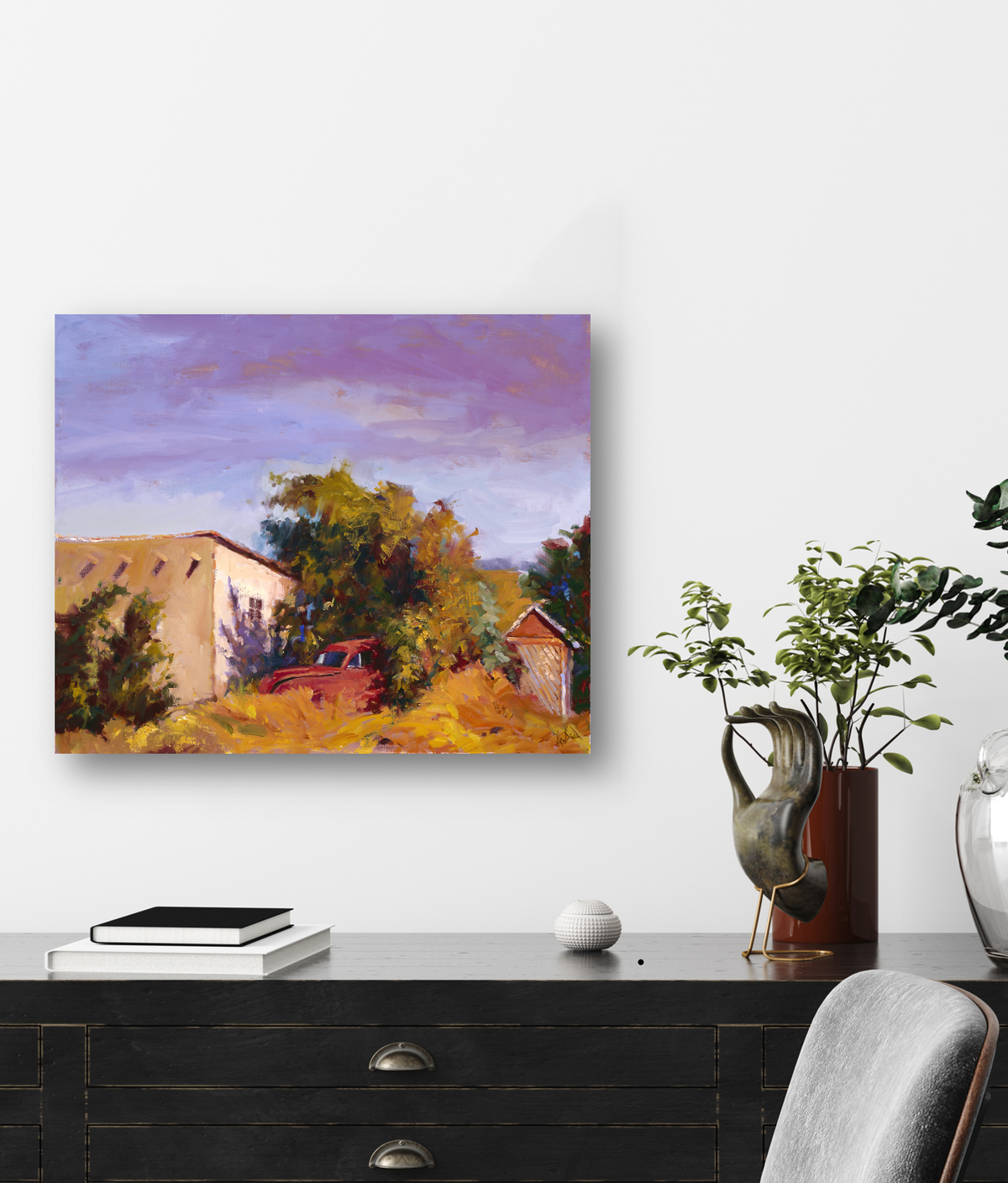 Canvas print of a red rusty truck partially hidden behind vibrant green bushes, parked near a white barn under a purple and orange sunset sky.