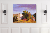 Colorful impressionist painting of a rusty red truck partially hidden among green and orange foliage beside a yellow building under a purple sky.