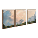 Triptych canvas art set depicting soft, pastel-colored clouds over a green landscape with wooden frames, each panel showing a different section of the sky scene.