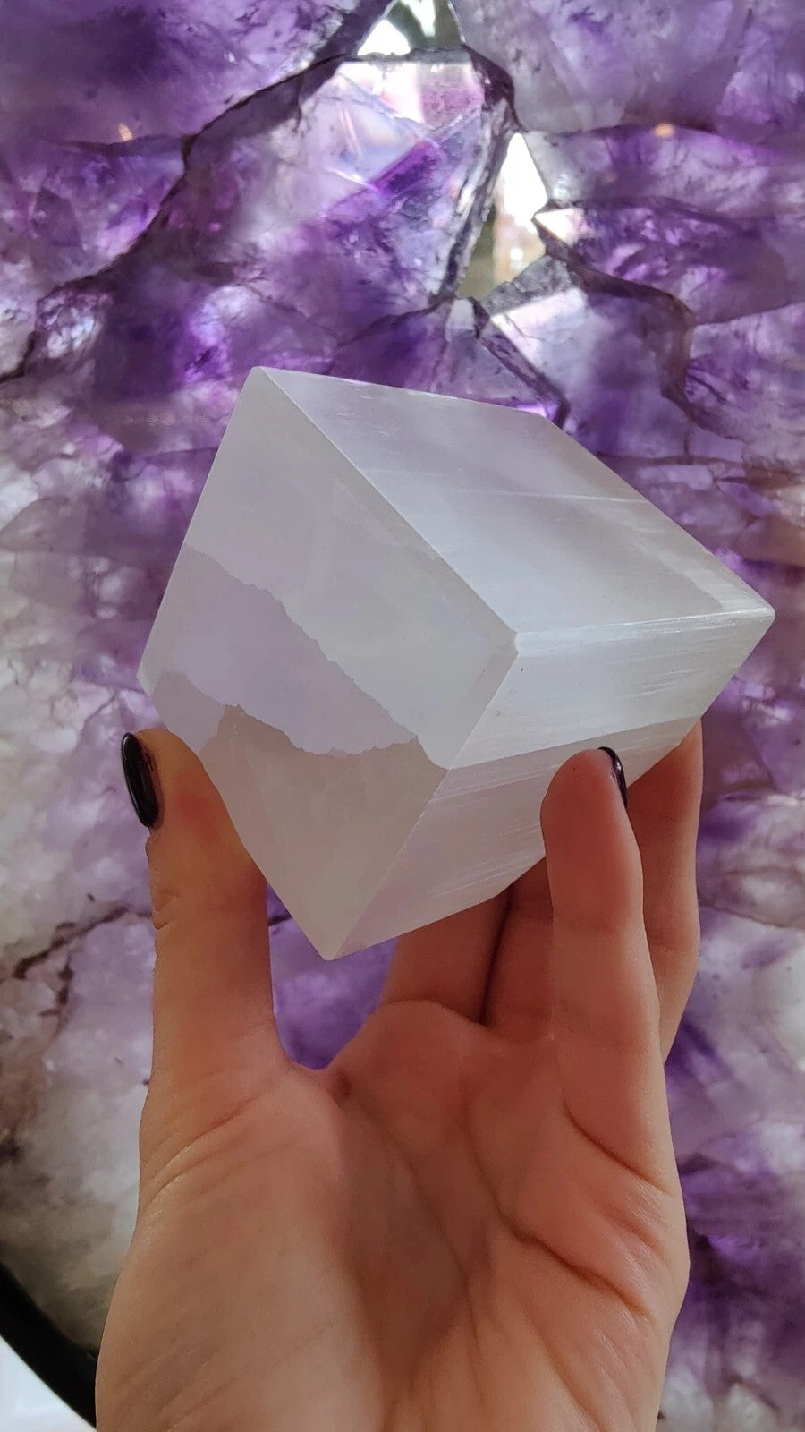 Selenite Standing Cube 5cm from Rare Earth Gallery, translucent white cube on wooden surface