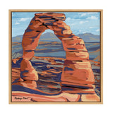 Painting of a large red rock arch with layered sandstone textures set against distant blue-gray mountains and a partly cloudy sky, framed in light wood.