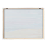 Abstract framed print featuring soft horizontal bands of pale blue, white, and beige evoking a calm beach scene with sand and surf effects.
