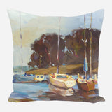 Painting of sailboats moored near a brown, tree-covered shoreline under a soft sky, printed on a square pillow with muted blue and beige tones.