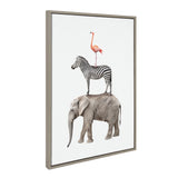 Framed canvas artwork showing a stacked arrangement of three safari animals: a pink flamingo atop a black-and-white striped zebra standing on a gray elephant.