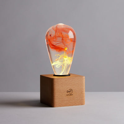 Solar Corona Resin LED Table Lamp with wooden cube base by EP Designlab