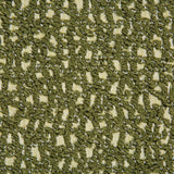 Close-up of Serra Pillow Cover fabric featuring a textured chive green knit pattern with hints of beige woven base material in a repeating design.