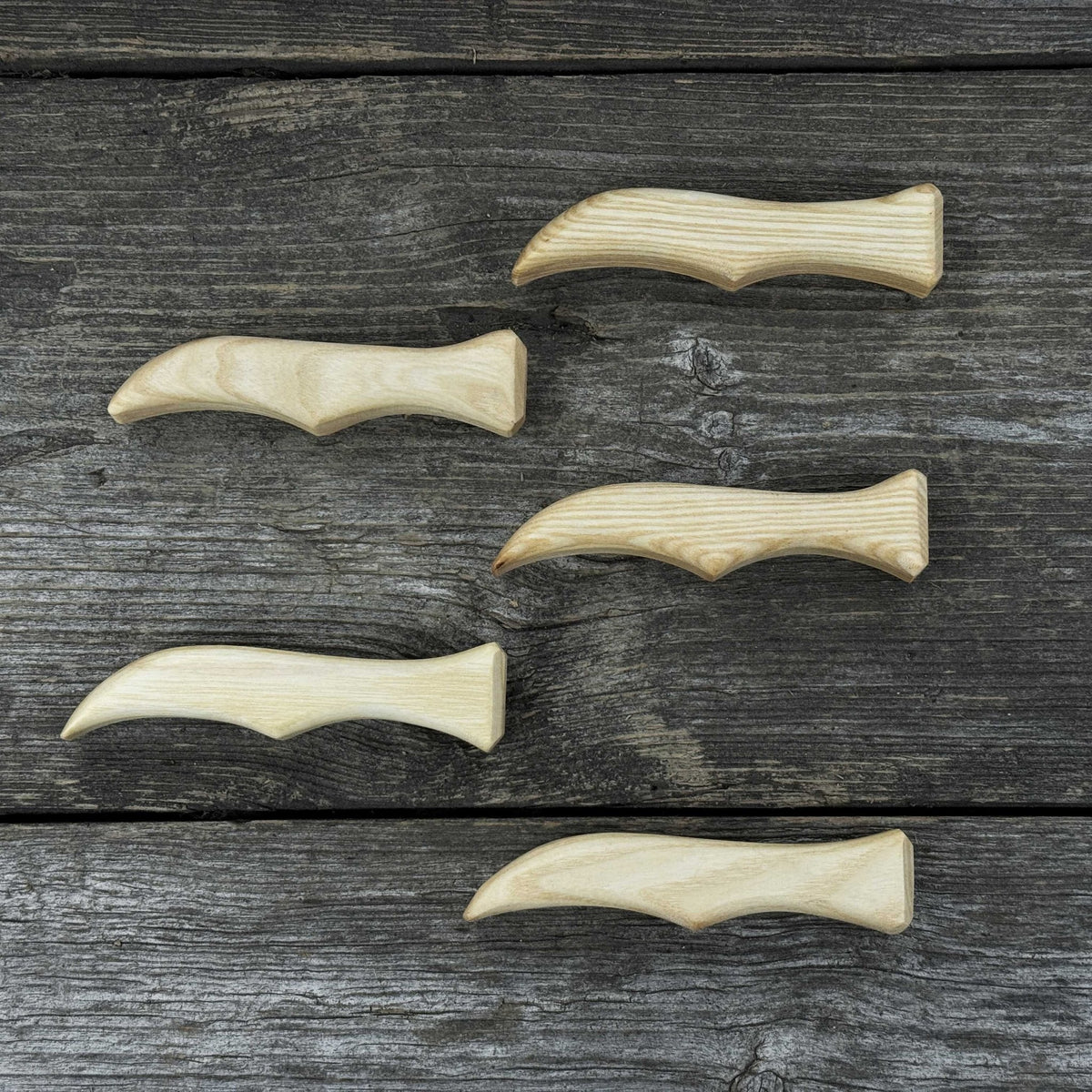 Set of 5 ergonomic ash wood knife handles by Sharky Forged Steel Tools