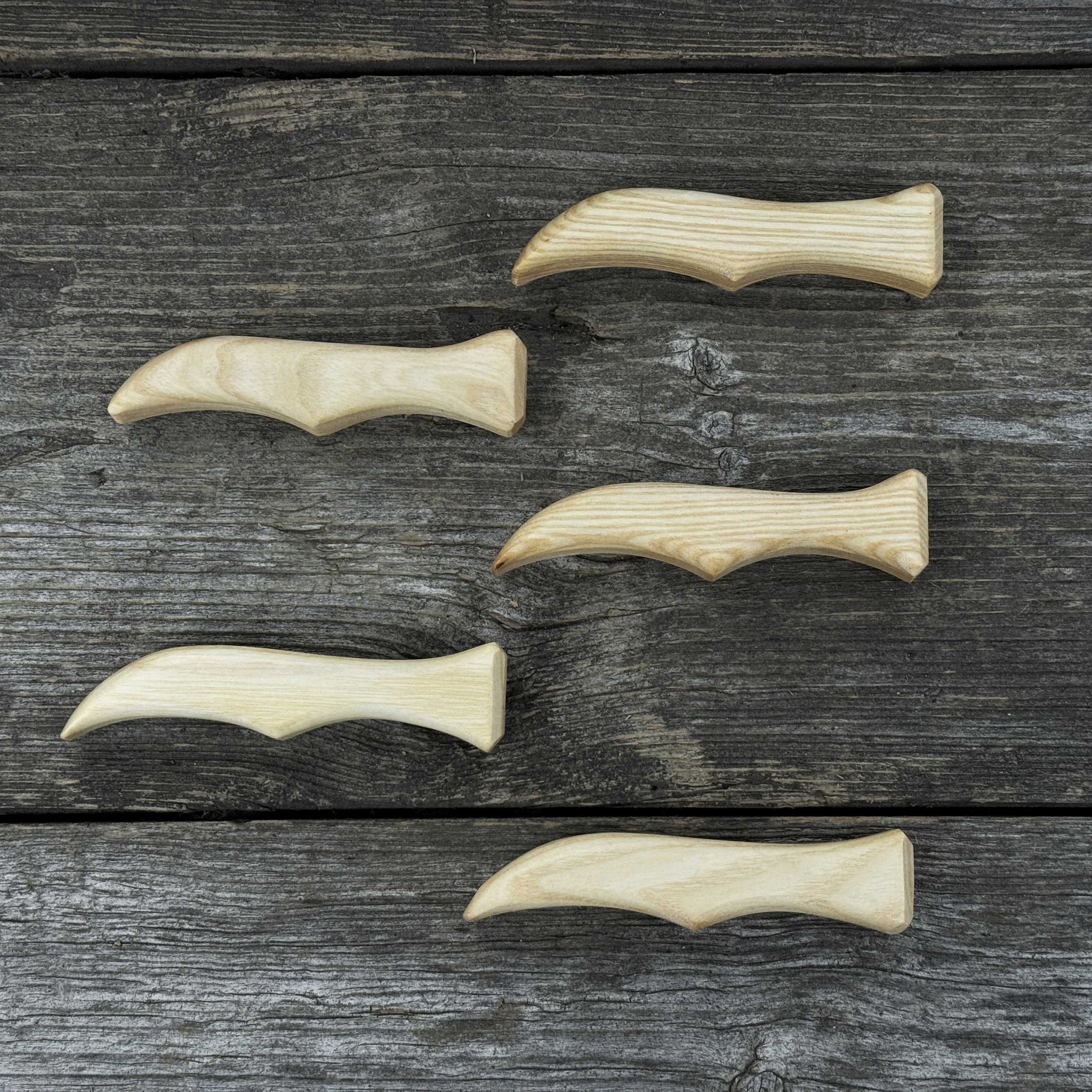 Set of 5 ergonomic ash wood knife handles by Sharky Forged Steel Tools