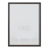 Three piglets sitting together inside a white vintage clawfoot bathtub against a plain background, framed in a dark wood frame with a glass front.
