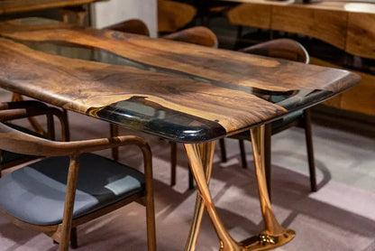 Custom epoxy resin dining room table with walnut wood and rose gold aluminum legs