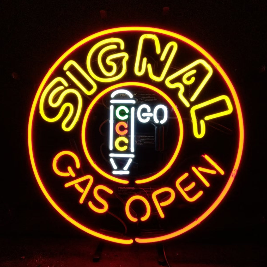 Neon sign with yellow uppercase 'SIGNAL' arched over a circular red outline and orange 'GAS OPEN' text below, featuring a white vertical gas pump graphic with green, red, and yellow circles inside.