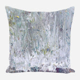 Square pillow featuring an abstract silver-gray textured pattern with subtle hints of green, yellow, and blue brushstrokes on a white background.