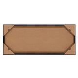 Back view of a rectangular framed canvas with a black outer frame and protective brown corner guards on each corner