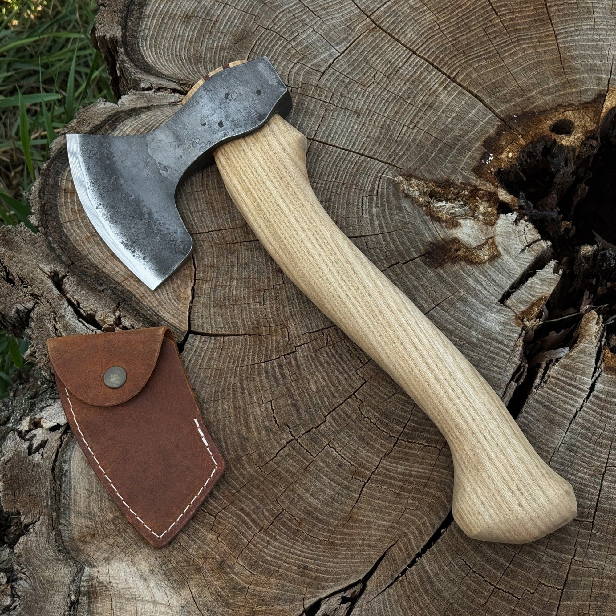 Small hand-forged carving axe with ash wood handle and leather sheath