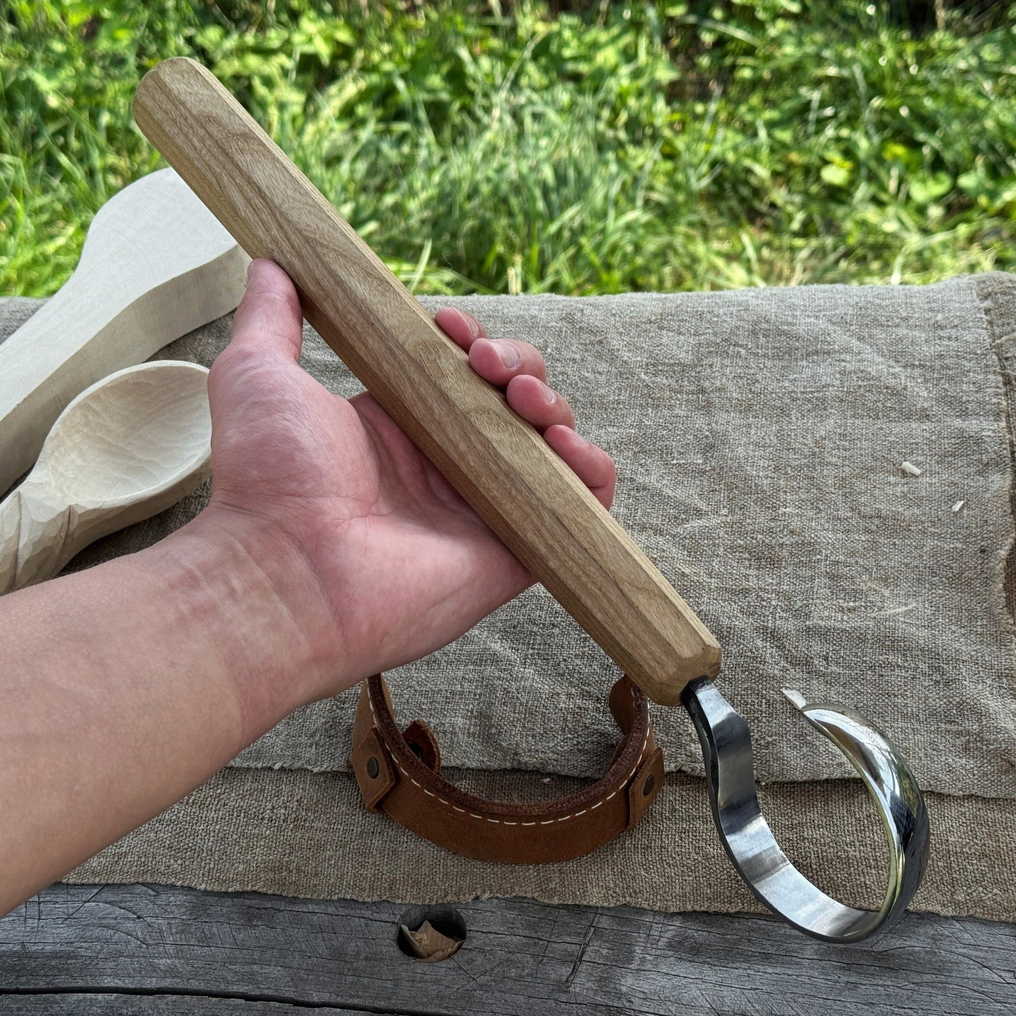 Small spoon carving hook knife with octagonal ash wood handle and curved blade