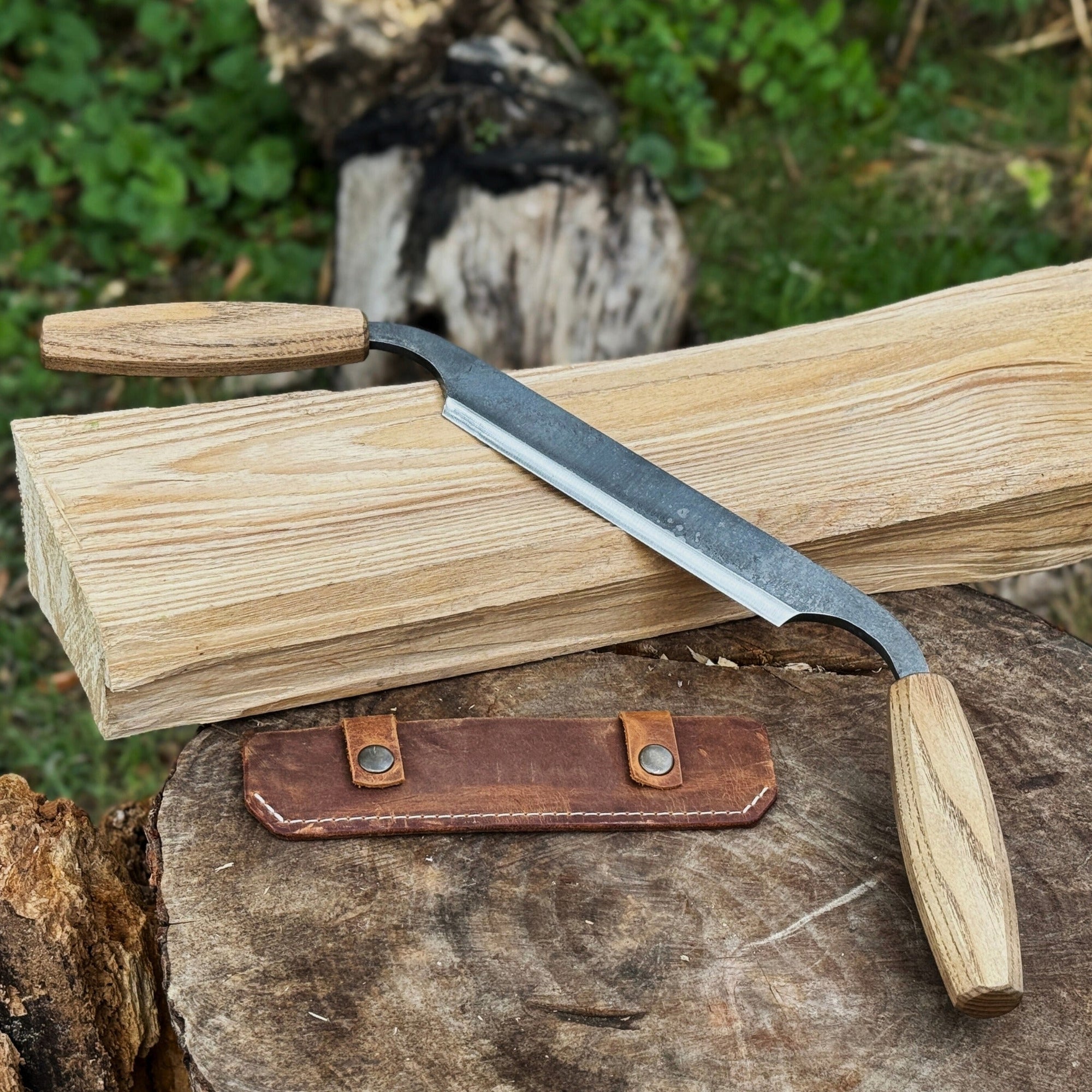 Small straight drawknife with 14.5 cm cutting edge and ash wood handle
