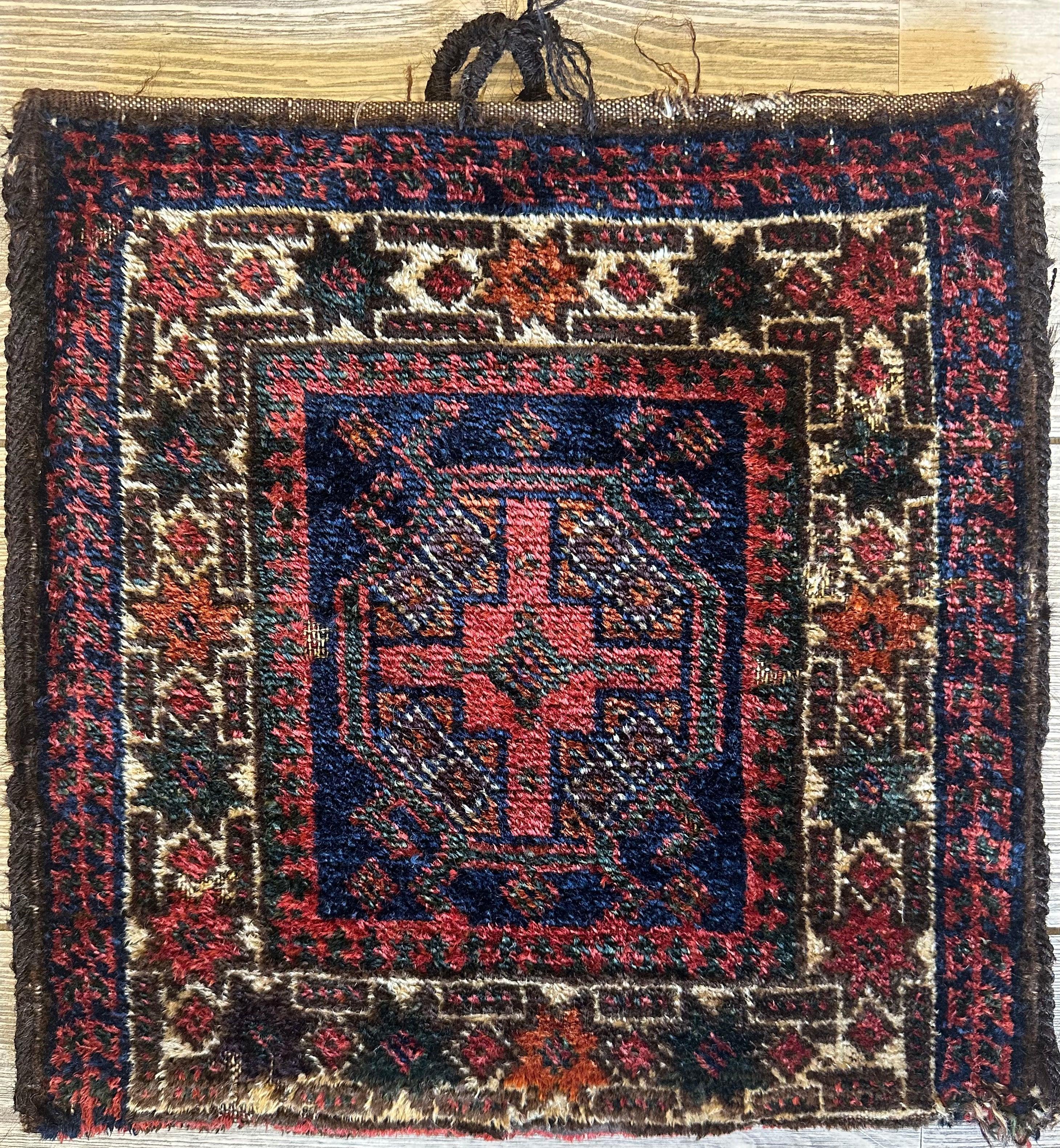 Small vintage Kurdish wool bag, hand-knotted, 14 by 14 inches with traditional geometric patterns in natural colors