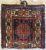 Small vintage Kurdish wool bag with a central red medallion and intricate geometric patterns in navy, cream, and earth tones, measuring about 14 inches square.