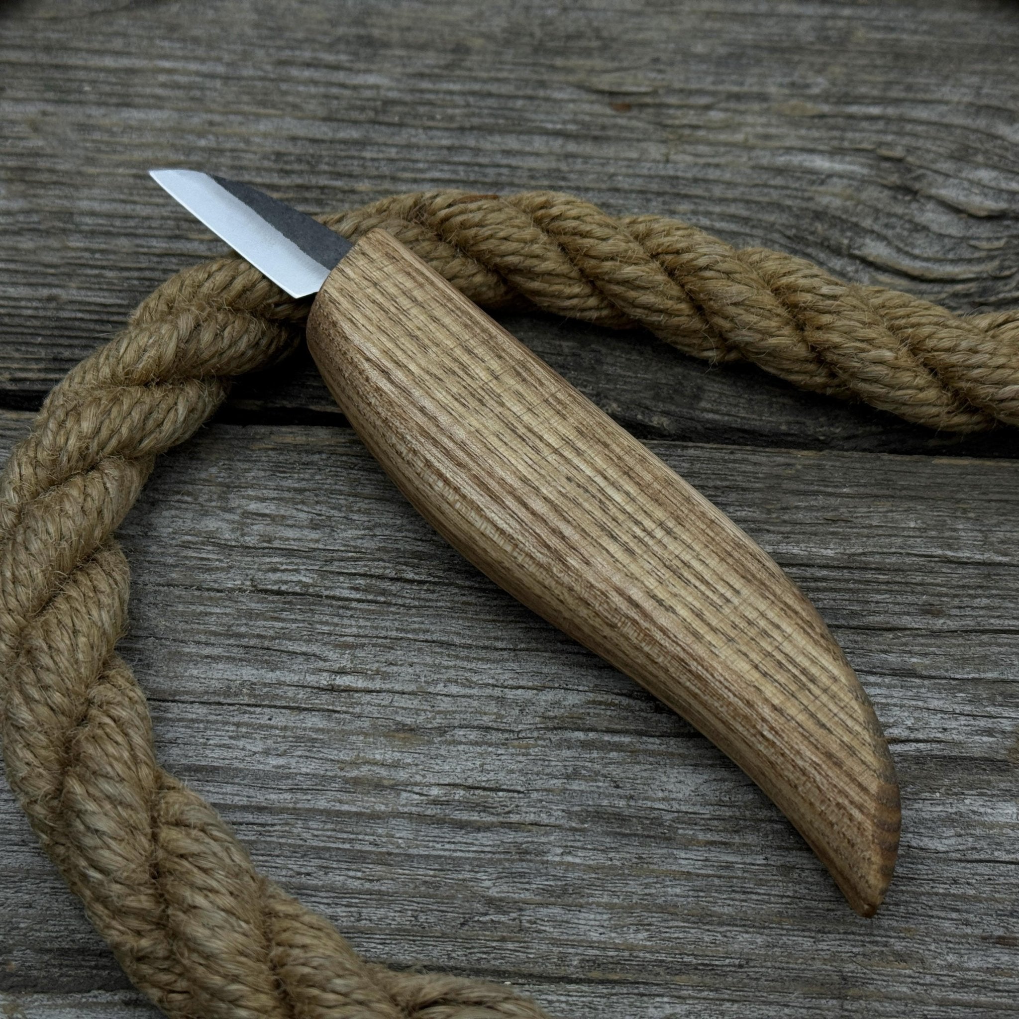 Small whittling carving knife with fine-tipped blade and ergonomic ash wood handle by Sharky Forged Steel Tools