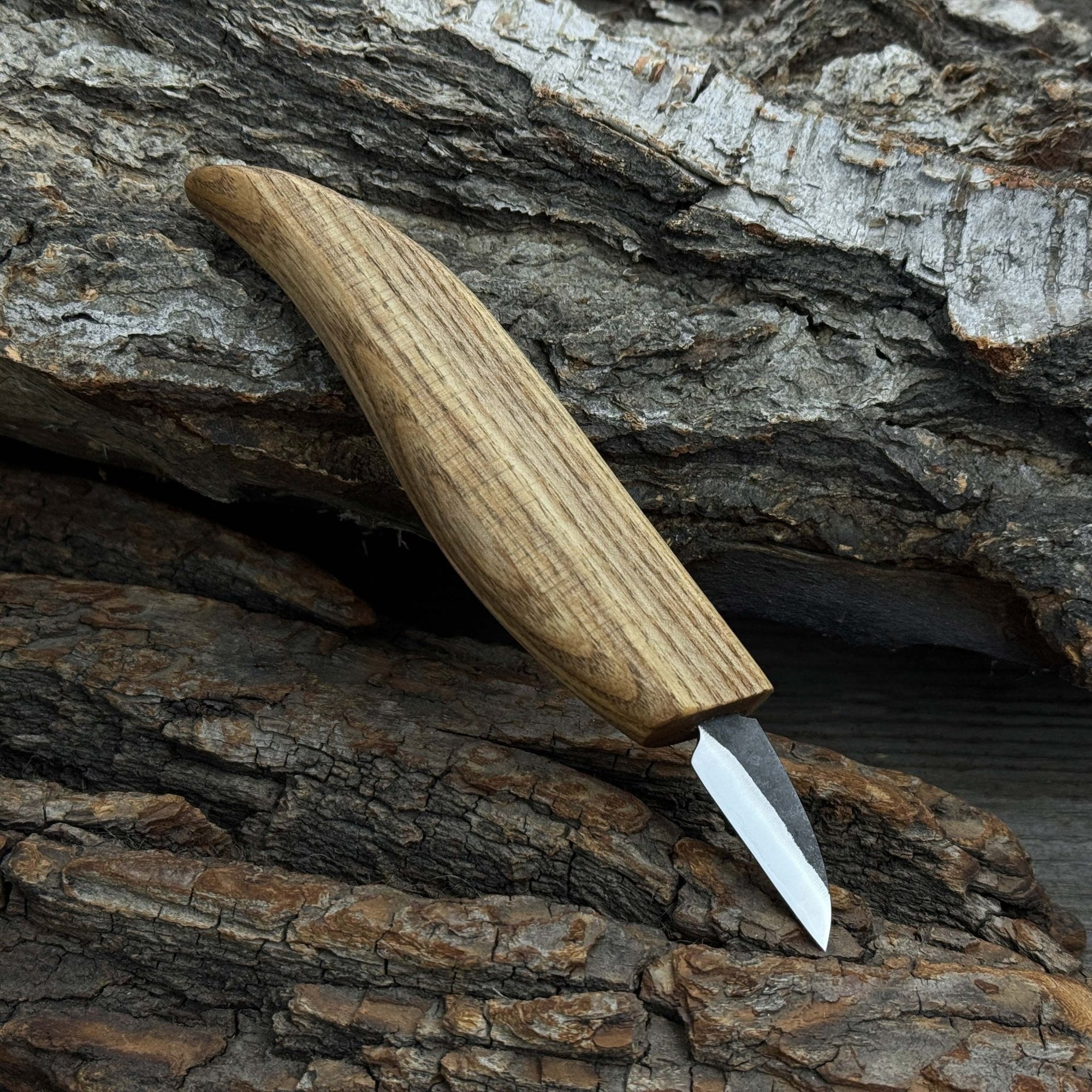 Small whittling carving knife with fine-tipped blade and ergonomic ash wood handle by Sharky Forged Steel Tools