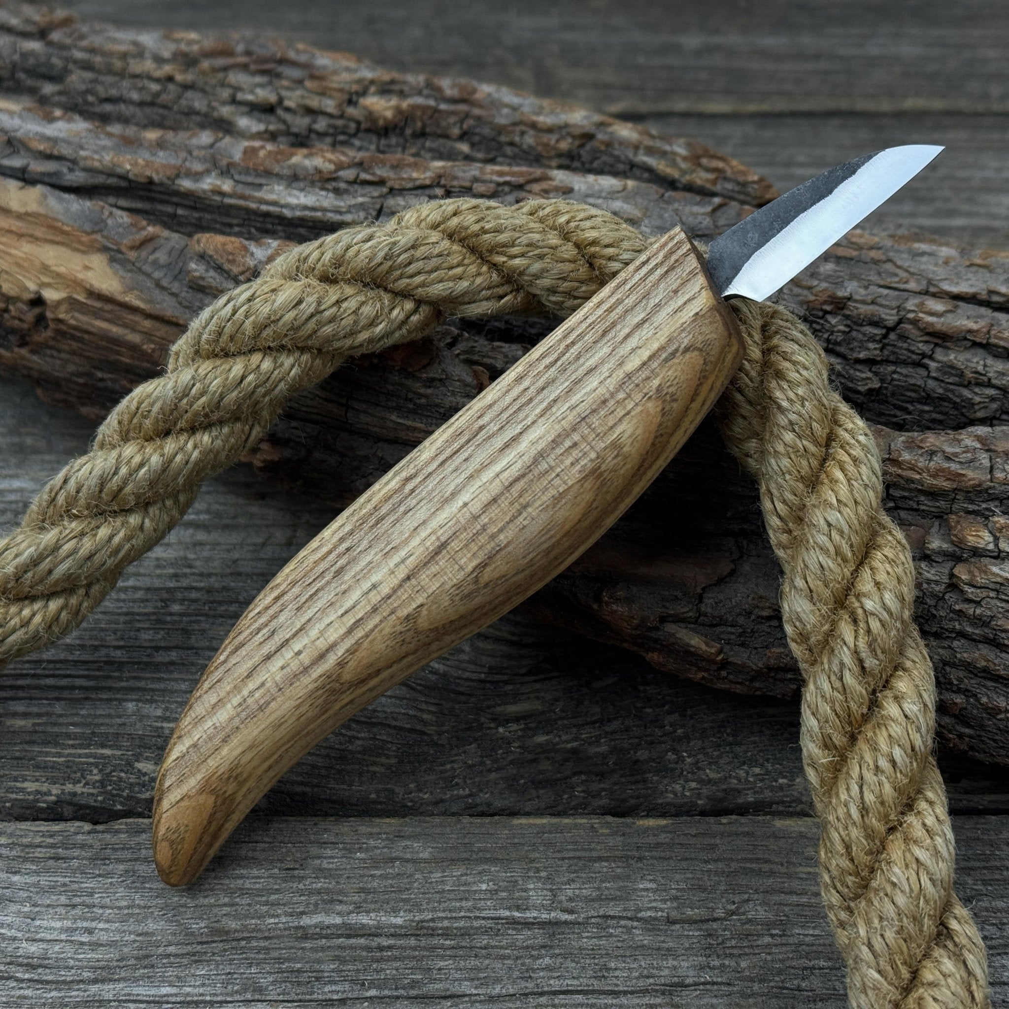 Small whittling carving knife with fine-tipped blade and ergonomic ash wood handle by Sharky Forged Steel Tools