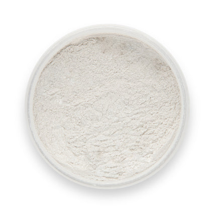 White powder in a clear container on a white background