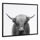 Black-and-white close-up portrait of a Highland cow with long shaggy hair covering its eyes and wide curved horns, centered in a black frame.