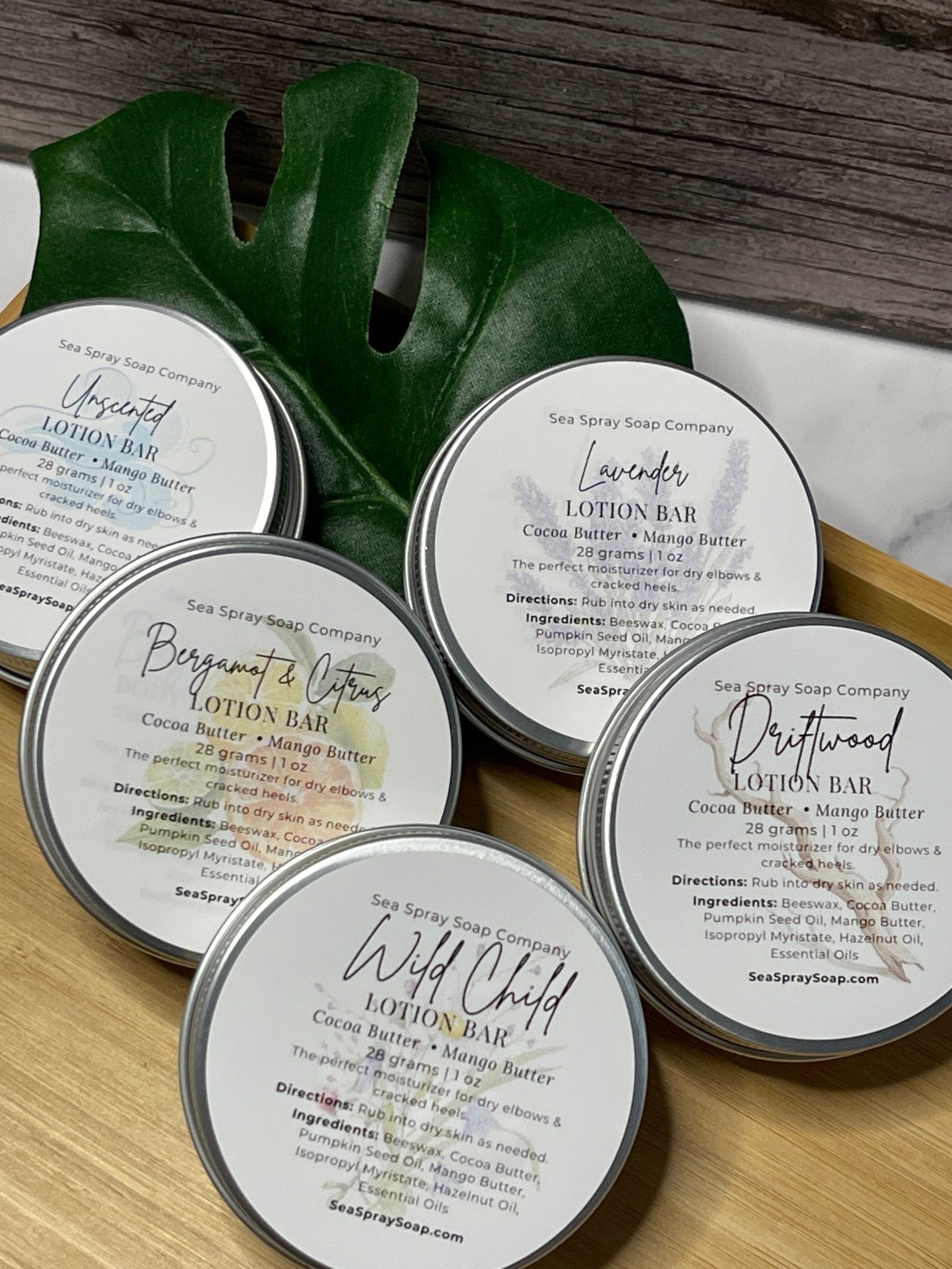 Solid Lotion Bars in reusable metal tins arranged neatly, showcasing natural skincare packaging.