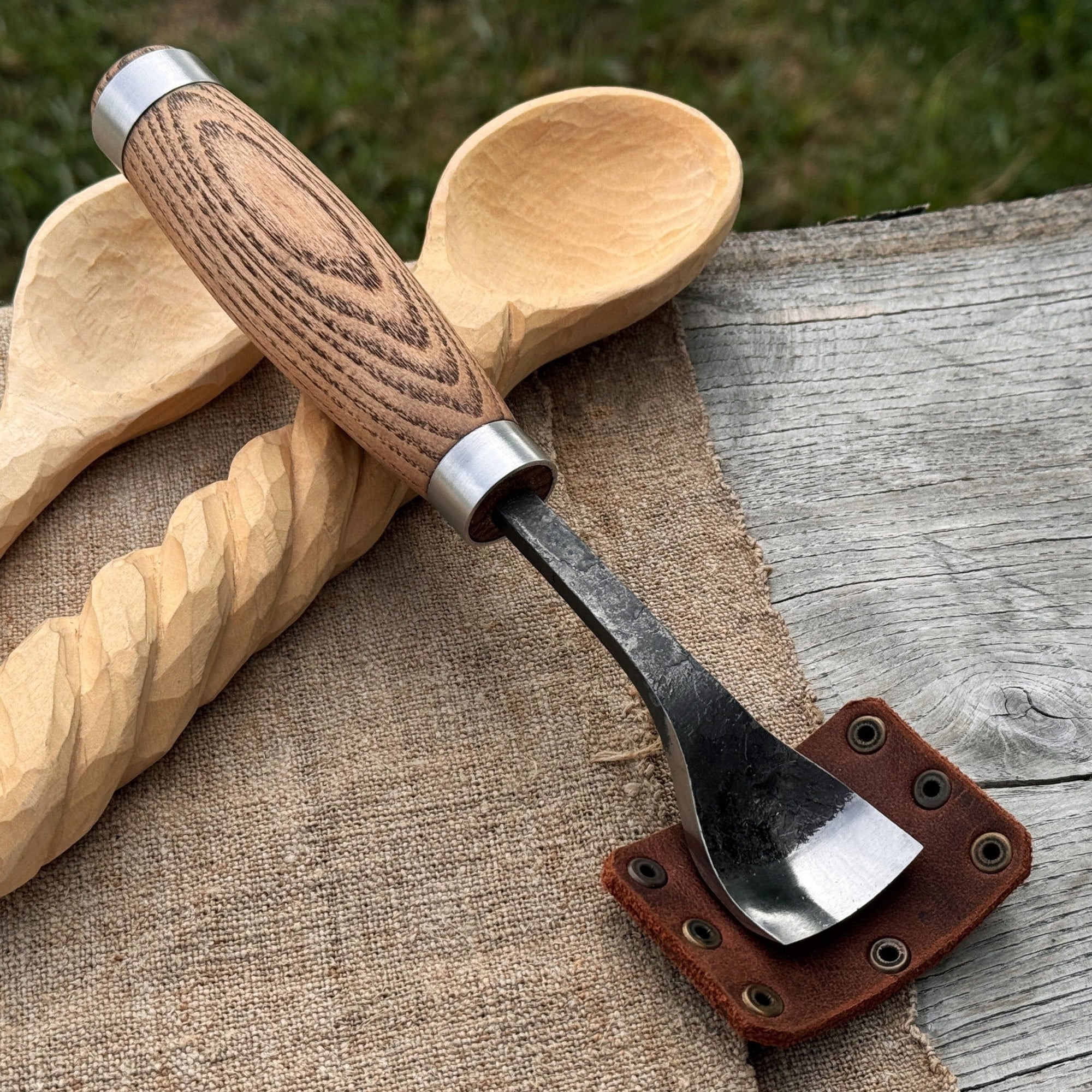 Hand-forged spoon bent gouge with ash wood handle and carbon steel blade