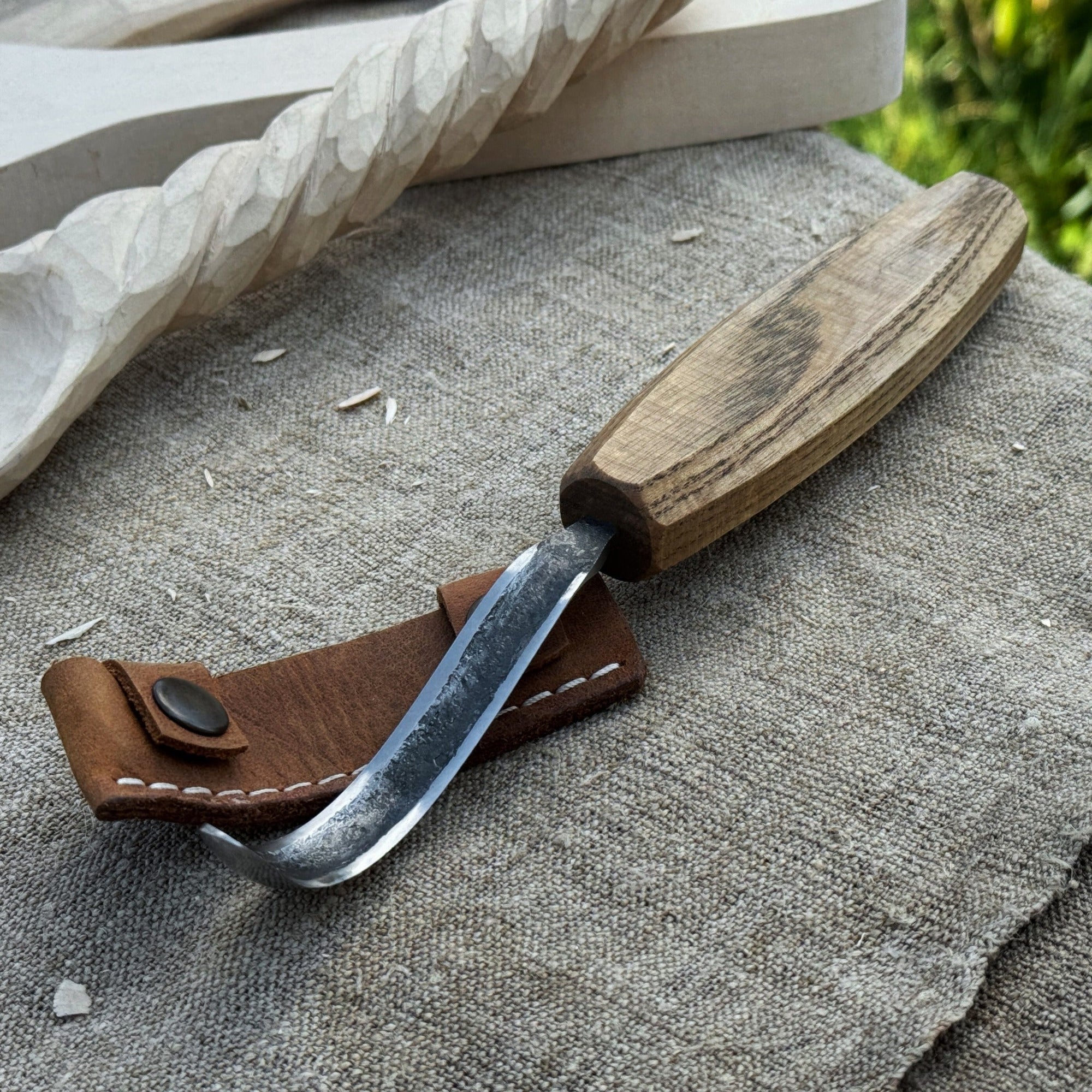 Spoon carving hook knife with long curved blade and wooden handle by Sharky Forged Steel Tools