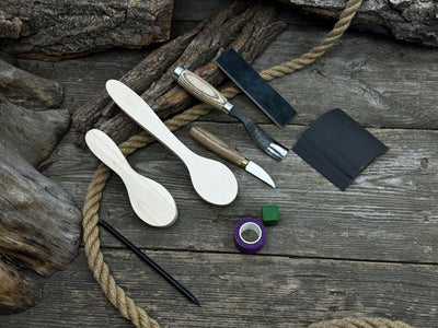 Complete Spoon Carving Kit with wood blanks, hand-forged tools, sandpaper, and accessories