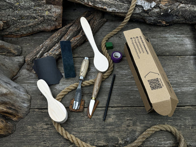 Complete Spoon Carving Kit with wood blanks, hand-forged tools, sandpaper, and accessories