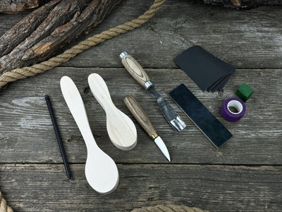 Complete Spoon Carving Kit with wood blanks, hand-forged tools, sandpaper, and accessories