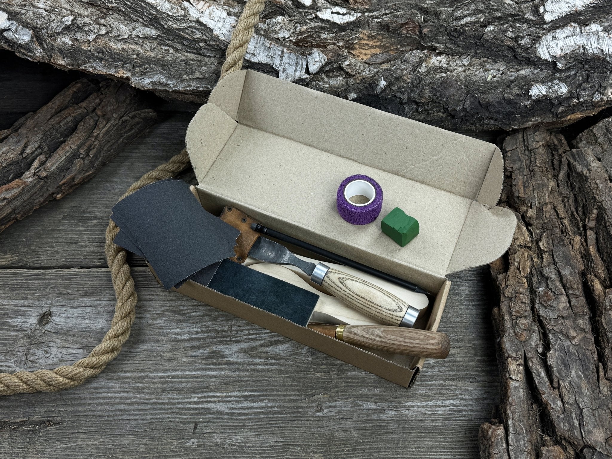 Complete Spoon Carving Kit with wood blanks, hand-forged tools, sandpaper, and accessories