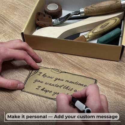 Complete Spoon Carving Kit with bent gouge, whittling knife, wooden blank, sandpaper, sharpening board, pencil, and finger wrap