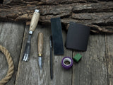Spoon Carving Kit with hand-forged tools, wooden blanks, sandpaper, and sharpening board