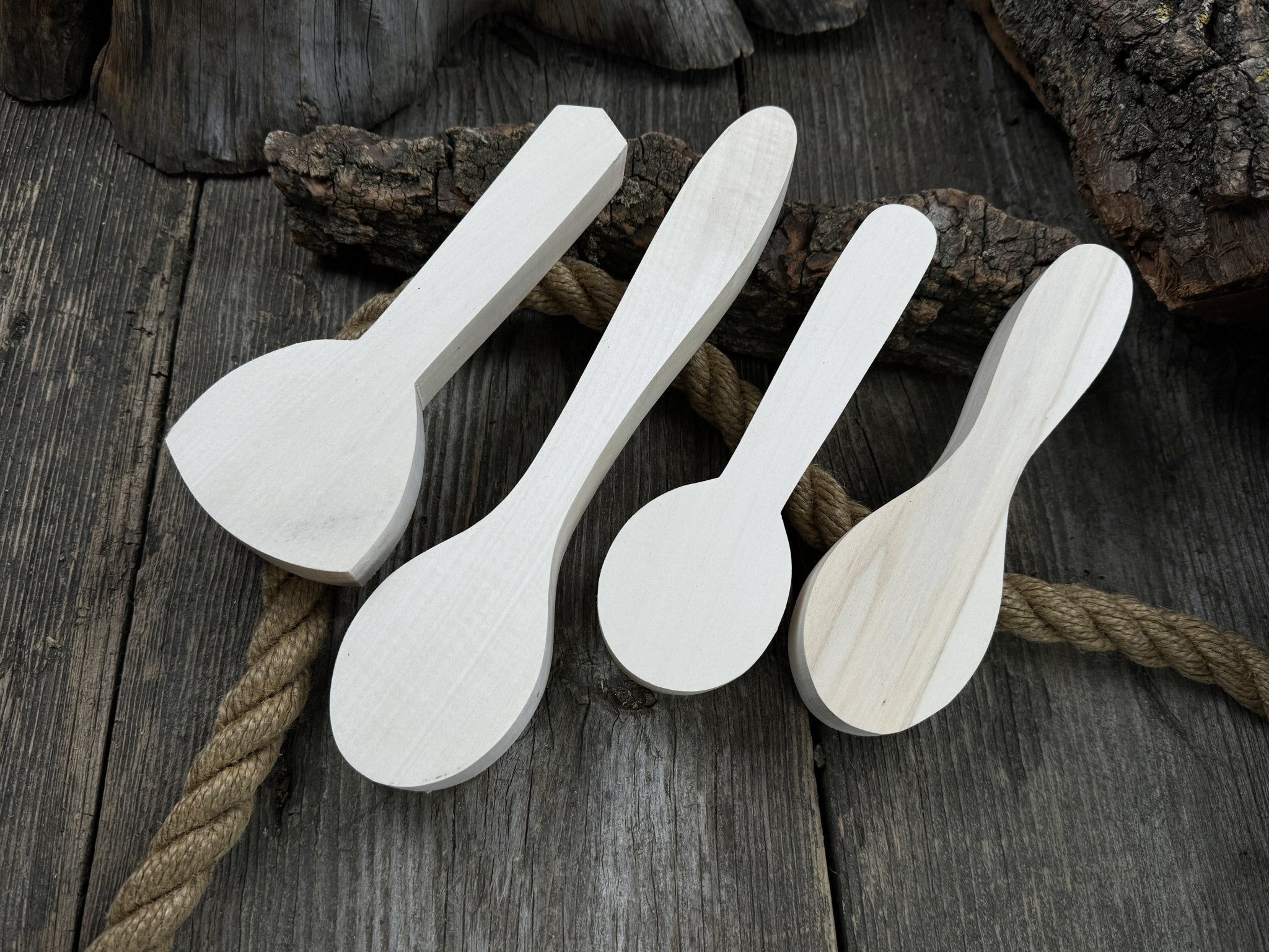 Spoon Carving Kit with hand-forged tools, wooden blanks, sandpaper, and sharpening board