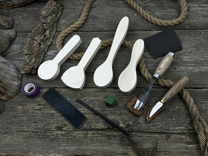 Spoon Carving Kit with hand-forged tools, wooden blanks, sandpaper, and sharpening board