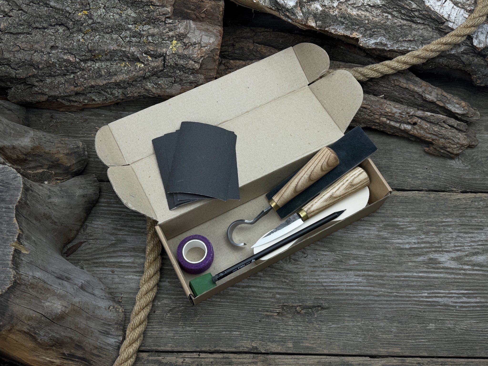 Spoon Carving Kit for Beginners with knives, wooden blank, sandpaper, and sharpening board